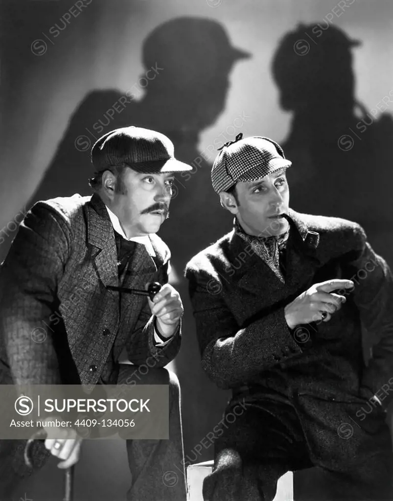 BASIL RATHBONE and NIGEL BRUCE in THE HOUND OF THE BASKERVILLES (1939), directed by SIDNEY LANFIELD.