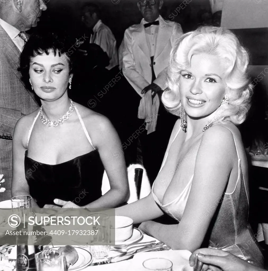 American actress and model Jayne Mansfield, known for her publicity stunts, attended a dinner at the exclusive Beverly Hills Romanoff's restaurant hosted by Paramount Pictures to officially welcome Italian actress Sophia Loren to Hollywood. A photograph of the two women, with Loren casting a sideways glance at Mansfield's cleavage, was distributed world-wide and became an international sensation.