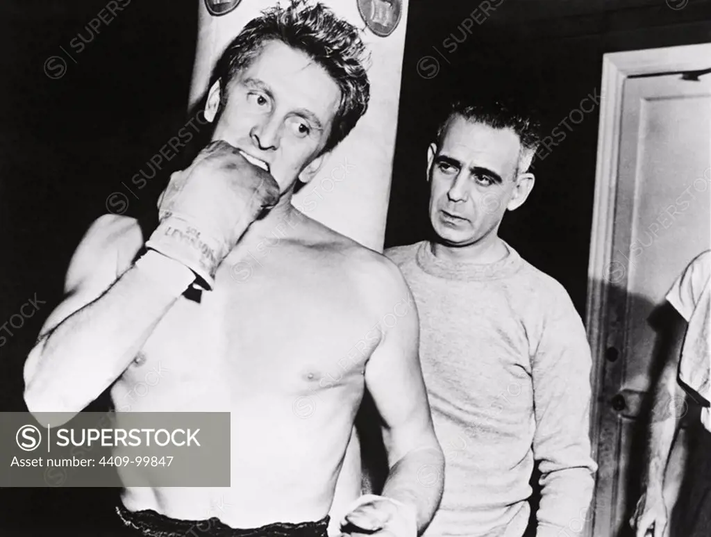KIRK DOUGLAS and PAUL STEWART in CHAMPION (1949), directed by MARK ROBSON.
