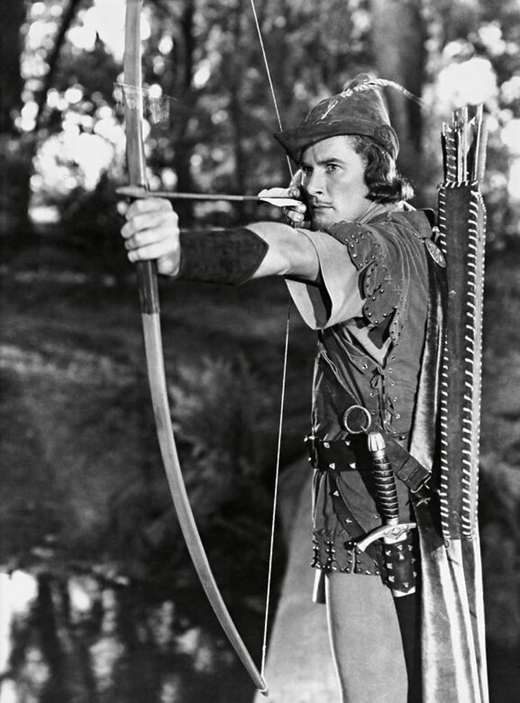 ERROL FLYNN in THE ADVENTURES OF ROBIN HOOD (1938), directed by MICHAEL CURTIZ and WILLIAM KEIGHLEY.