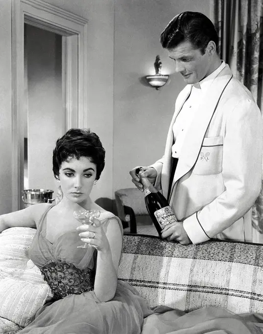ROGER MOORE and ELIZABETH TAYLOR in THE LAST TIME I SAW PARIS (1954), directed by RICHARD BROOKS.