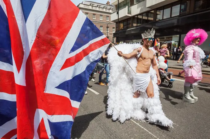 Participant holding union jack in the Annual Gay Pride Parade, London, England