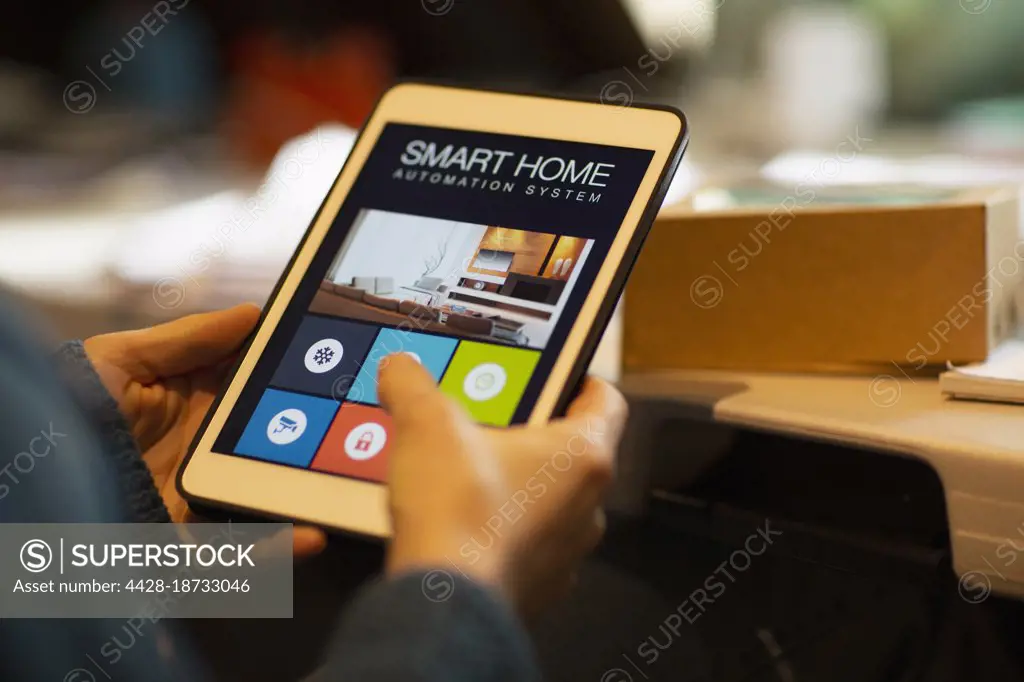 Close up woman looking at home automation on digital tablet