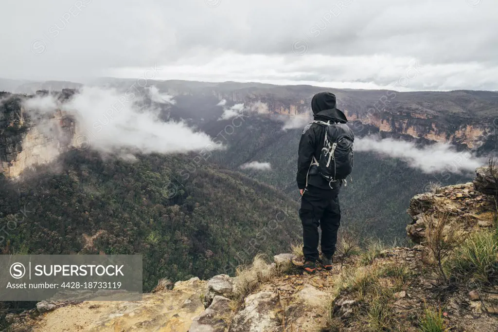 Male hiker on remote mountaintop, Australia