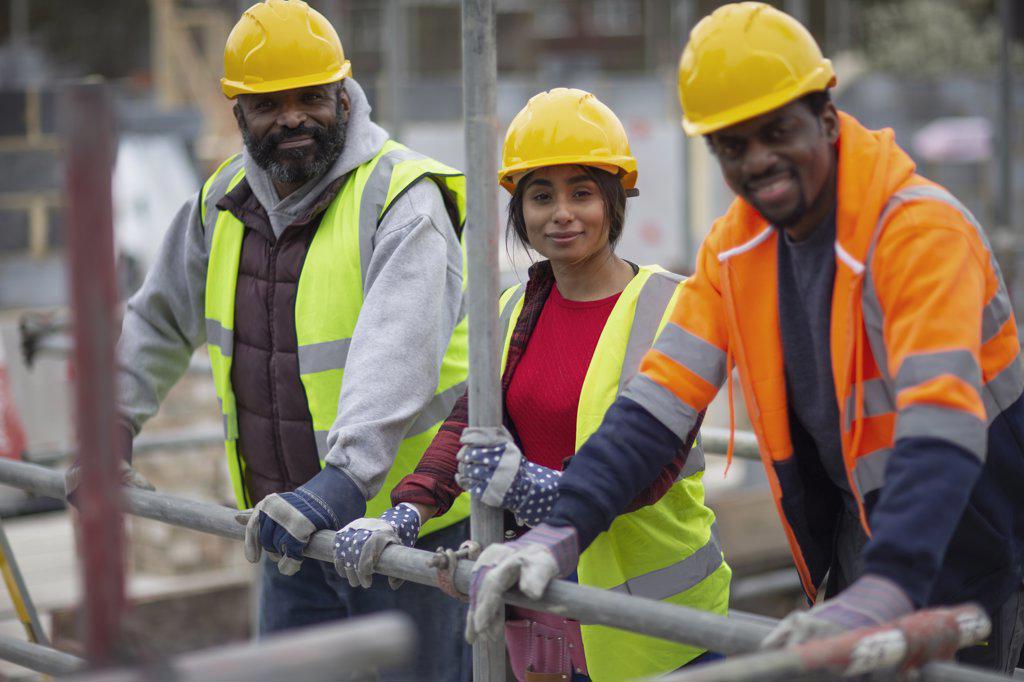 Portrait confident construction workers at construction site