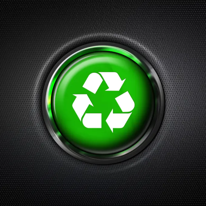 Close up green recycle symbol button