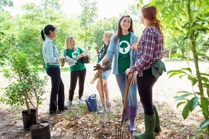 Environmentalist volunteers planting new tree