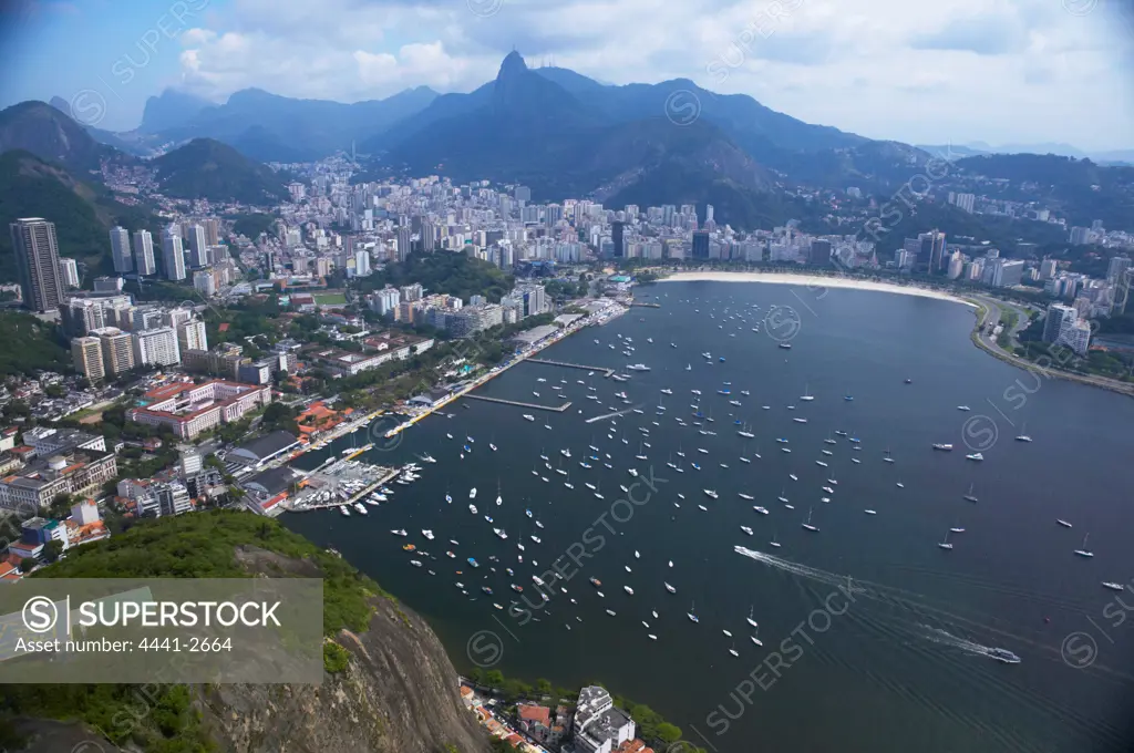 Premium Photo  Yacht club in urca bay of rio de janeiro and christ the  redeemer between the clouds leaning out