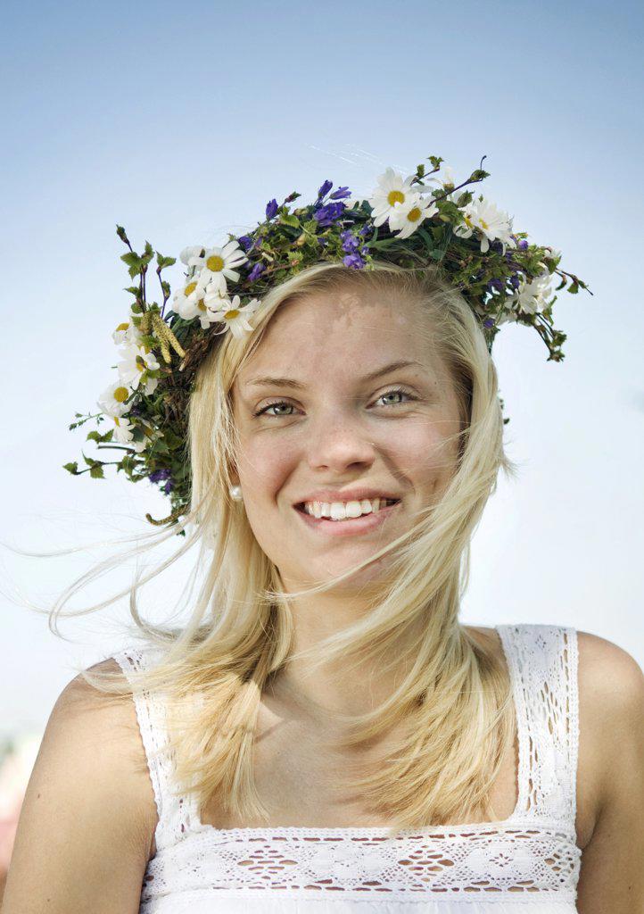 Young female wearing garland of flowers