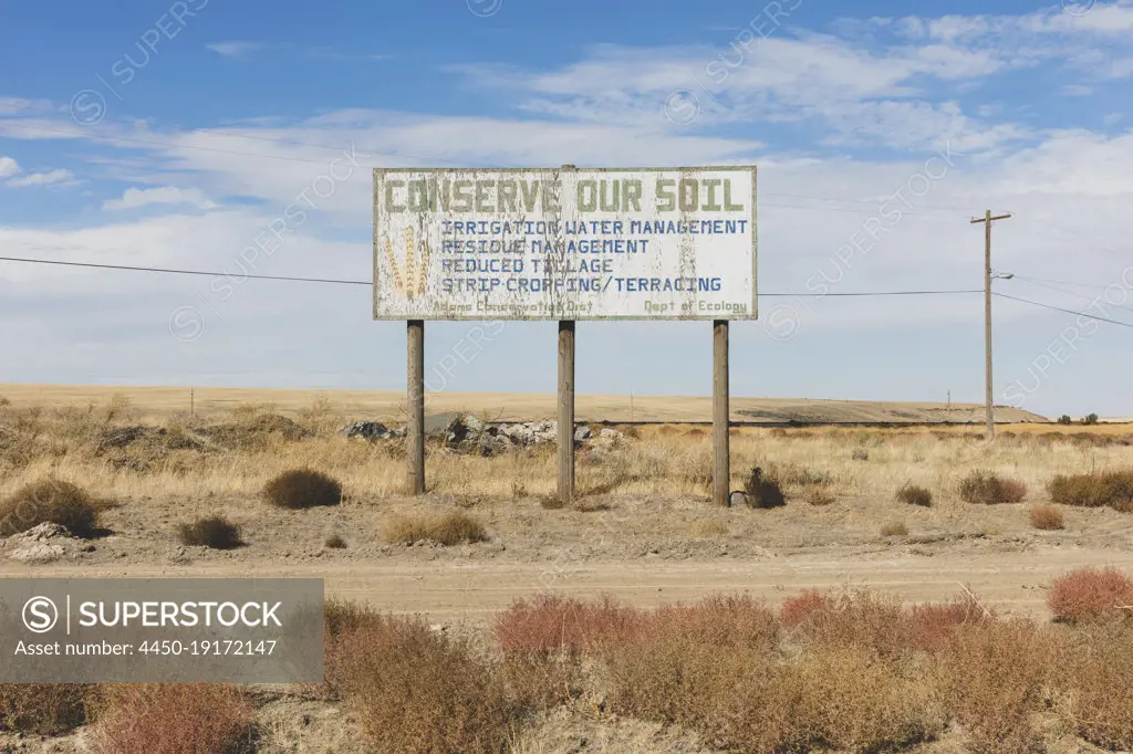 Conserve Our Soil message on a roadside billboard. 