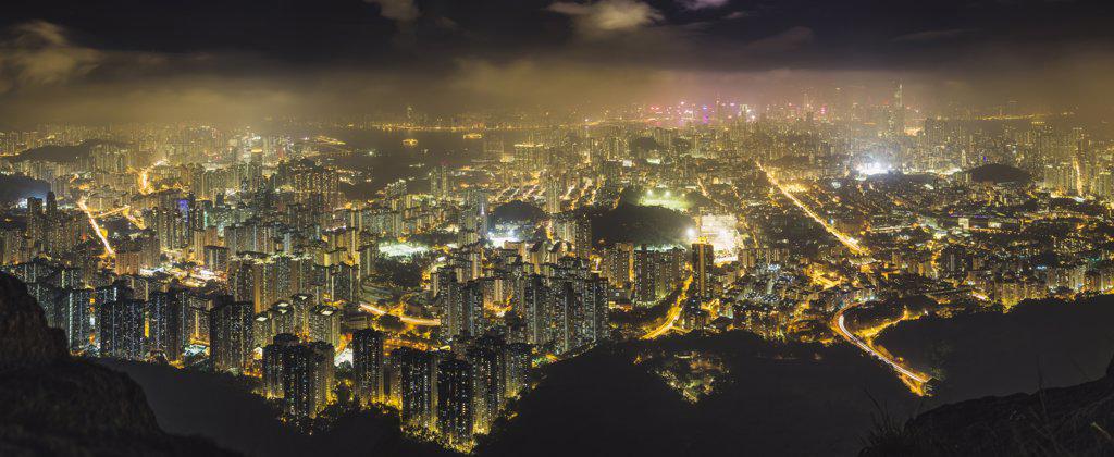 Hong Kong island seen from the hills, lit up at night.