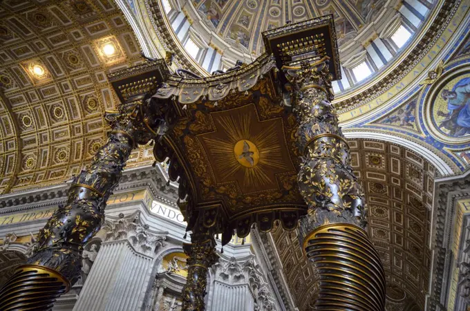 St Peter's Basilica in Rome, Italian Renaissance architecture, and UNESCO world heritage site. Interior views, of the domed ceiling with sacred artwork and frescoes.