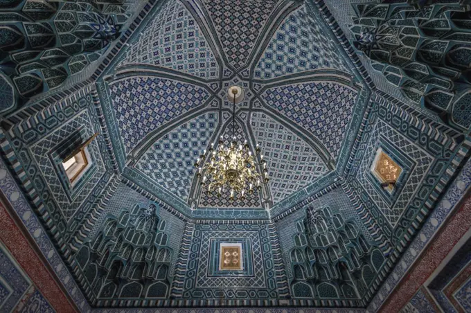 Interior, mosaic patterns in a dome of a Madrasa building in Samarkand.
