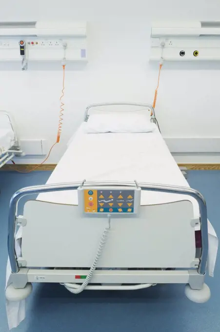 Hospital bed in vacant hospital room