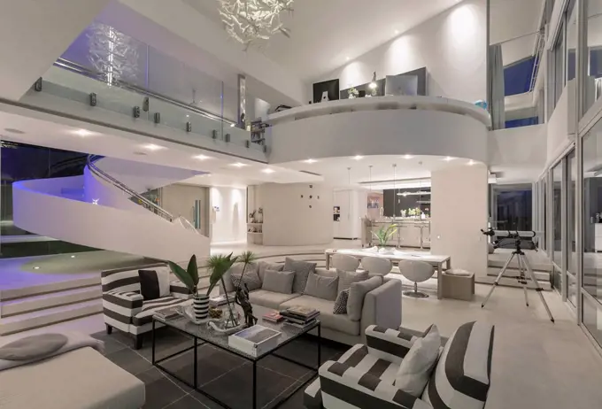 Illuminated modern luxury home showcase interior open plan