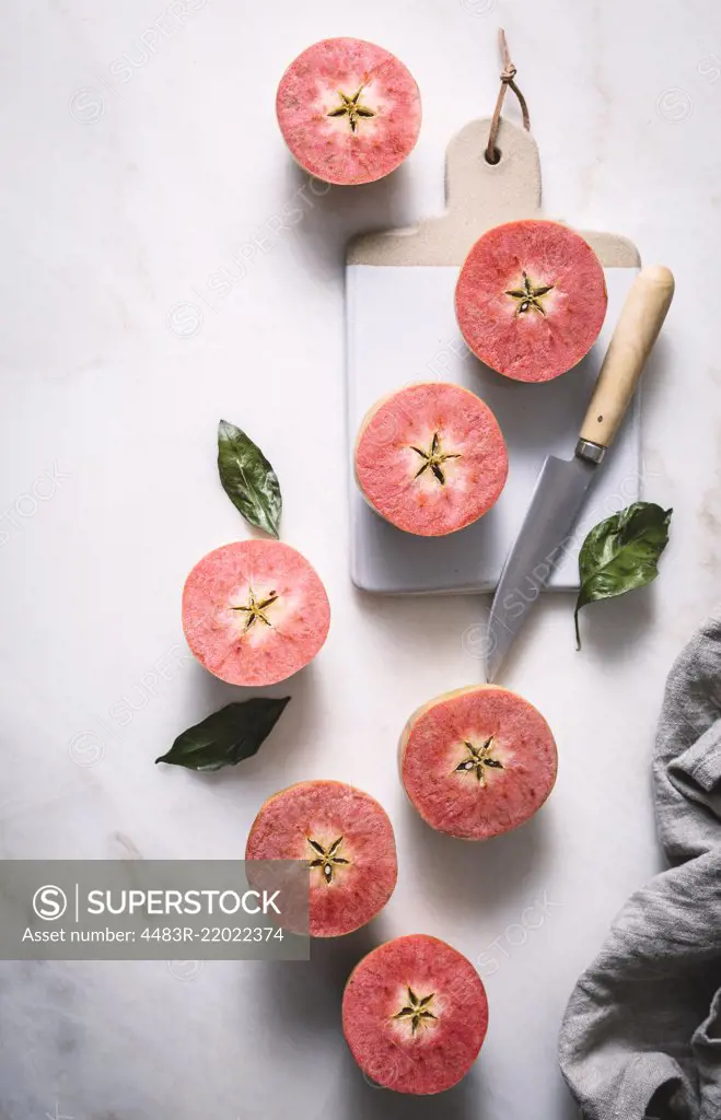Pink apples sliced in half