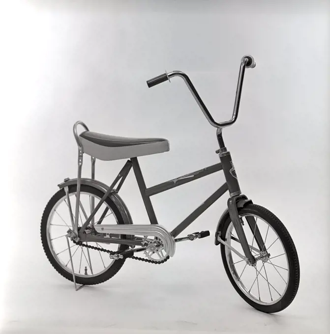 1960s bicycle. A childrens bicycle model that was considered the coolest thing around for a child of the 1960s with high handlebars and a loaf seat. Sweden 1966 ref CV40-6