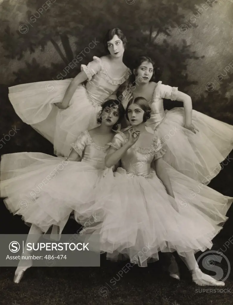 Four ballet dancers performing ballet