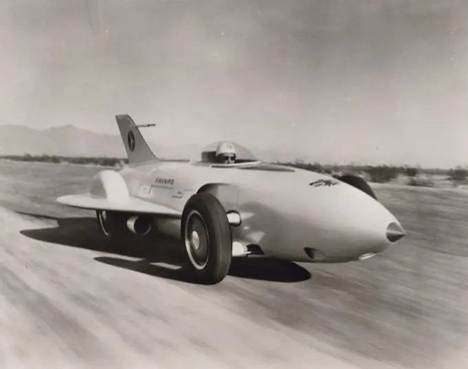 USA, Arizona, Test Driver Mauri Rose in plastic covered cockpit, General Motors XP-21 Firebird skim over test at GM Desert, First gas turbine automobile in the United States, the Firebird has unique aircraft styling with vertical tail fin and swept-back delta wings on its glass fiber-plastic body. The car was built to test the gas turbine's possibilities for ground vehicle and