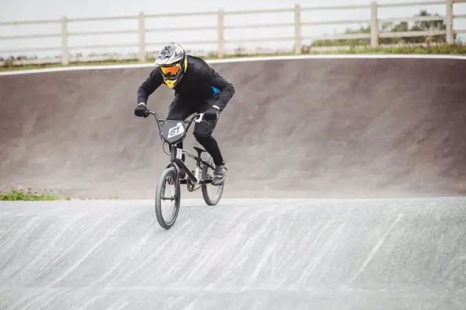 Cyclist riding BMX bike in skatepark