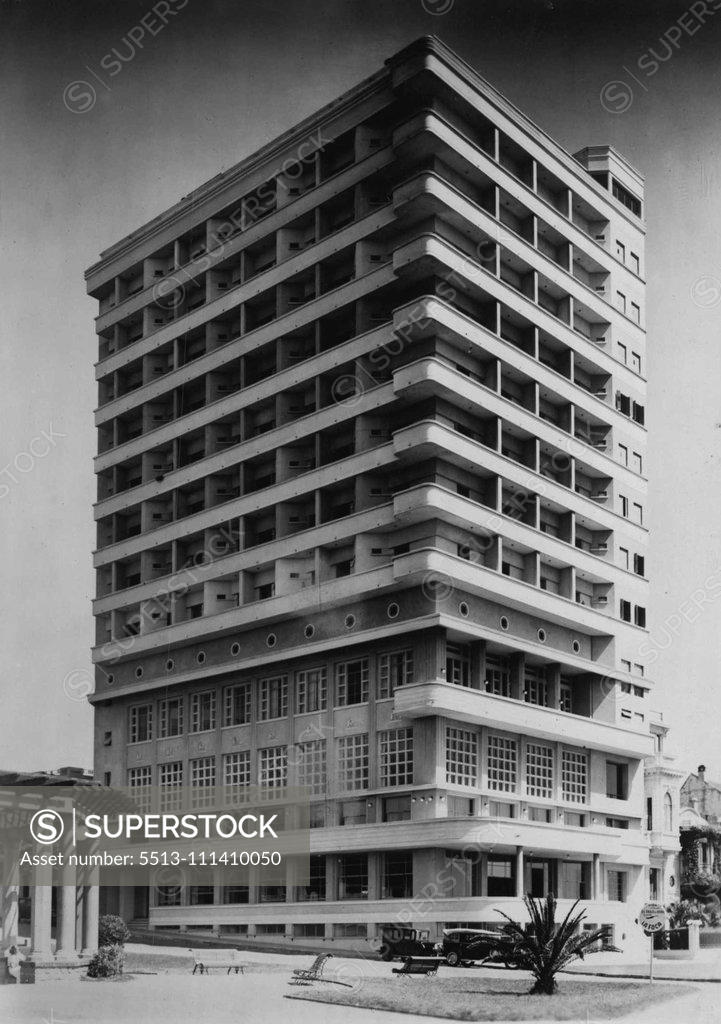 Stock Photo: 5513-111410050 Modern Structures In Uruguay -- New York's model of modern high - rise buildings is emerging in Uruguay line management and architectural balance are to be regarded as extremely tasteful. For example, U.B. A hotel building in Montevideo, the capital of Uruguay. December 8, 1937.