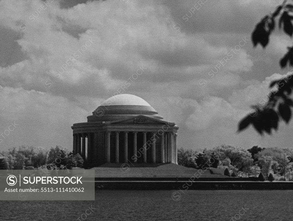 Stock Photo: 5513-111410062 Similar in design to Monticello, home of our third President Jefferson Memorial Washington stands among Japanese cheery trees on Tidal Basin. President Roosevelt dedicated this memorial in 1943. June 23, 1948.