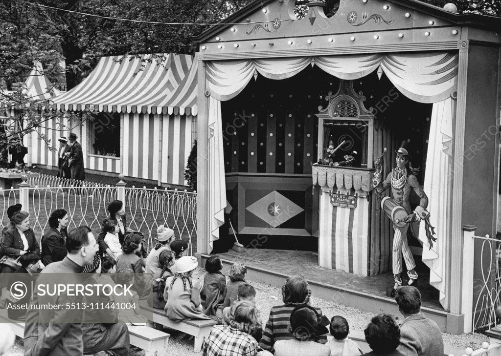 Stock Photo: 5513-111441004 Festival Gardens At Batter sea are Open Today -- The first Punch and Judy show to be held attracts a crowd among the early visitors to the newly opened Festival Gardens today. May 28, 1951. (Photo by Fox Photos).