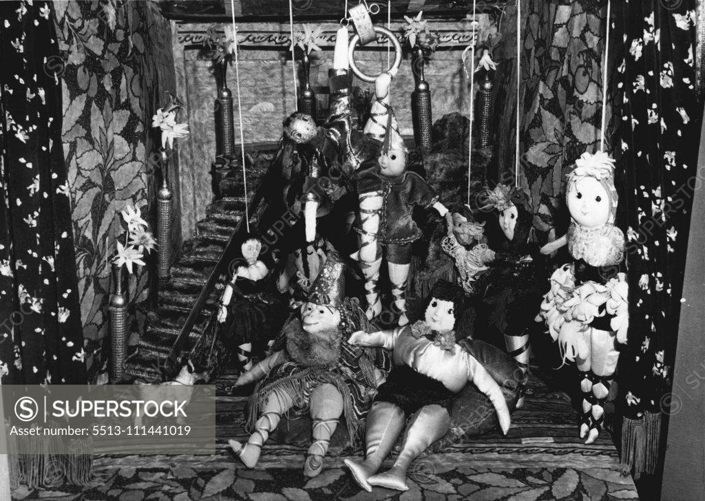 Stock Photo: 5513-111441019 Made by Mrs. V. Curretti Marie teacher of Rushcutters Bay this miniature theatre will sent to an orphanage? by the Sun Toy Fund. The mannequins are worked by strings from the top of the stage. January 09, 1943. (Photo by Barry Newberry/Fairfax Media).