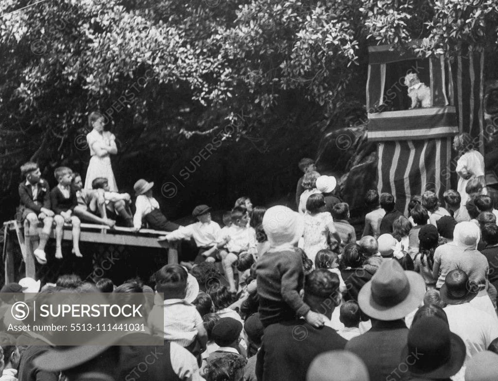 Stock Photo: 5513-111441031 The Old Favorite -- Punch and Judy show, one of the altractions for the juveniles at the Water Board picnic at Clifton Gardens to-day. October 17, 1932.