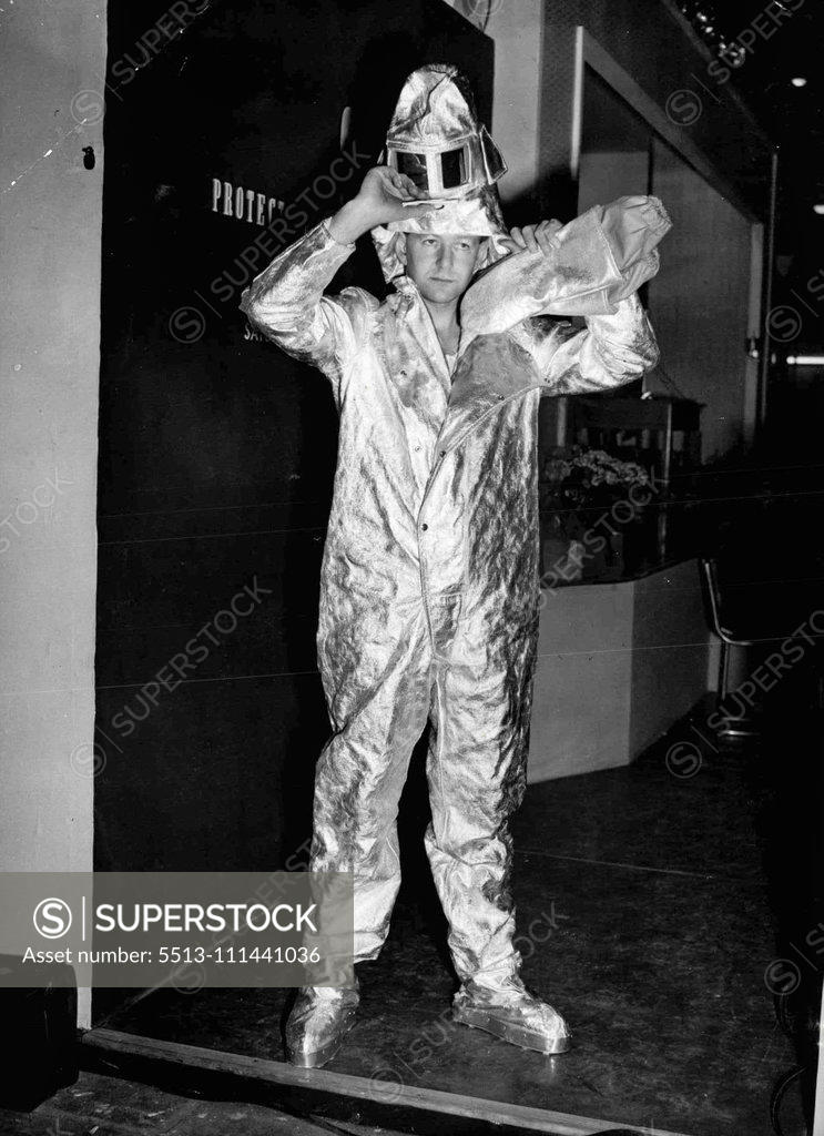 Stock Photo: 5513-111441036 Aluminium Protection -- Aluminium foil makes this Siebe Gorman fire protection suit, which can resist a heat at 200 degrees centigrade, shown at the Factory Equipment Exhibition, which opened at Earl's Court, London, to-day (Monday). March 28, 1955. (Photo by Reuterphoto).