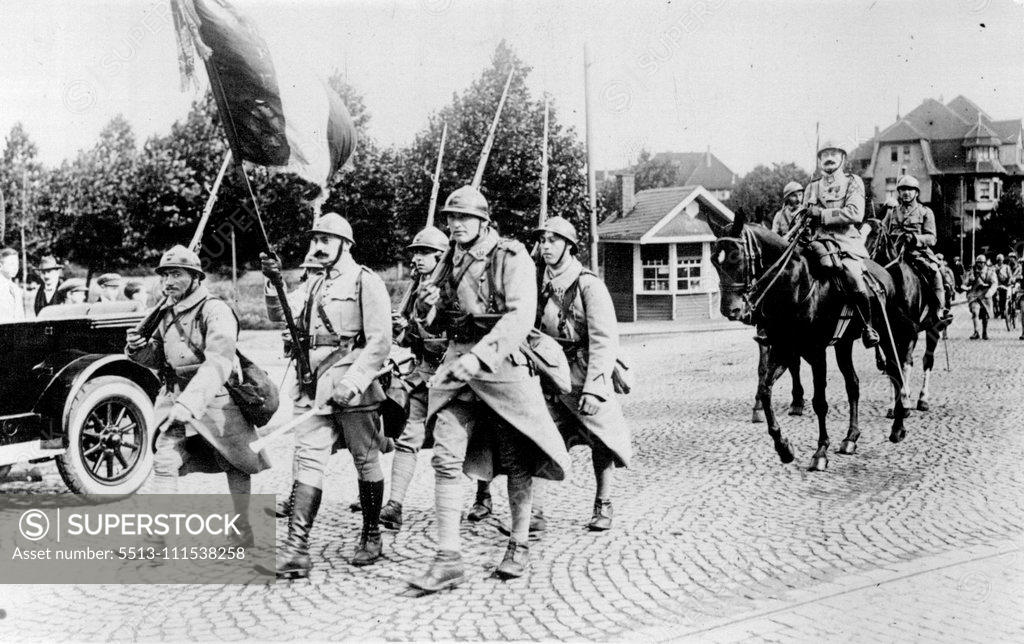 Stock Photo: 5513-111538258 French Troops Leave Essen: French troops leaving with their colours. Animated scenes were witnessed on the departure the French troops from Essen. January 1, 1929. (Photo by Central News).
