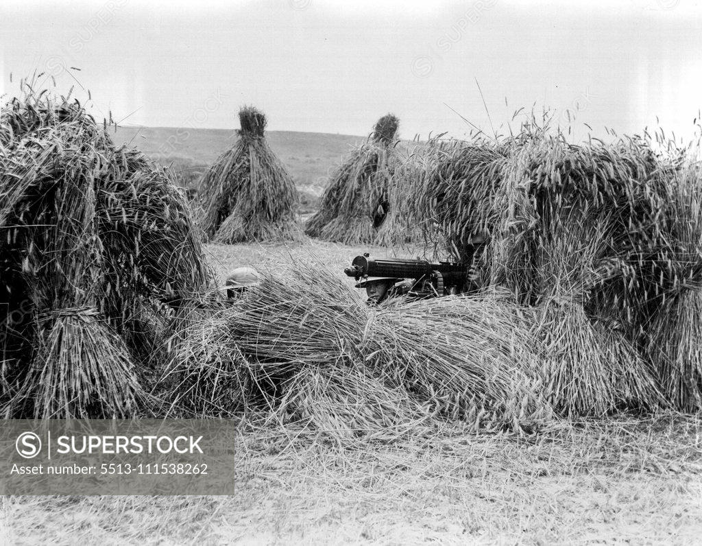 Stock Photo: 5513-111538262 British Army's Last Days on the Rhine: A machine gun section of the Royal Fusiliers in a stack of rye during manoeuvres on the Rhine near Wesbaden. The evacuation of the Rhine is due to begin next month. August 23, 1929.