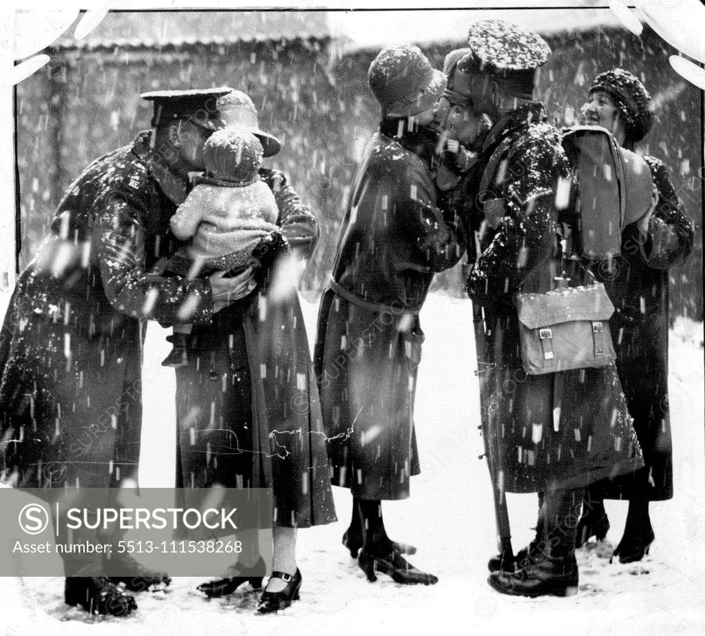 Stock Photo: 5513-111538268 The Evacuation of Cologne, Farewell Scenes in the Snow: The British Army, after seven years, commenced the evacuation of cologne on the eve of the signing of the Locarno treaty in London. Royal Engineers saying good-bye to their wives (who will follow later) before ***** for Wiesbaden en route for England. January 1, 1929. (Photo by Sport & General Press Agency, Limited).