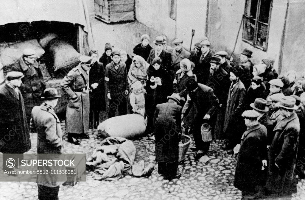 Stock Photo: 5513-111538281 Nazi Police in Poland: A truck carrying bags of rye and wheat with other goods was trapped in the early hours of morning ny Nazi Army Police. The truck was searched and all the people in connection with it now face long terms of imprisonment. These smuggled pictures just received in England via Switzerland and New York give some idea of the attitude adopted by the Nazi Army Police of Occupation. The Polish people, Jews and Gentiles, have all their possessions subjected to vigorous search and lon