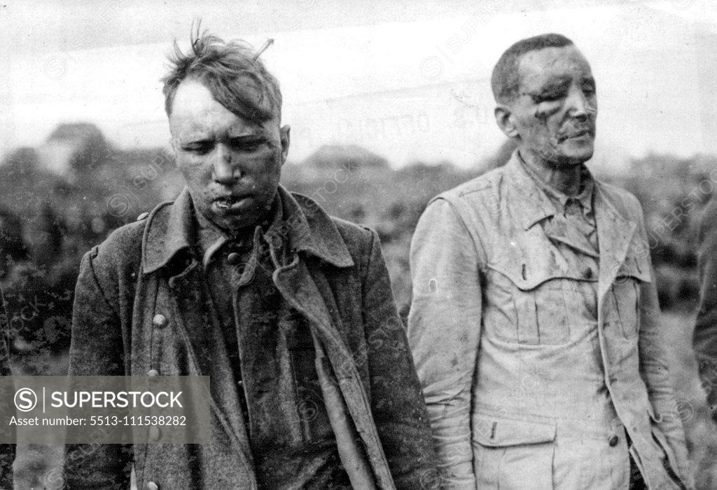 Stock Photo: 5513-111538282 A close-up of two of the ten men accused by captured wermacht men of killing U.S. Army prisoners of war at Malmedy, Belgium, during the battle of the Bulge. They were taken by the 3rd U.S. Army near Passau, Germany. The two were beaten by Wermacht soldiers. December 17, 1945. (Photo by U.S. Official Photo).