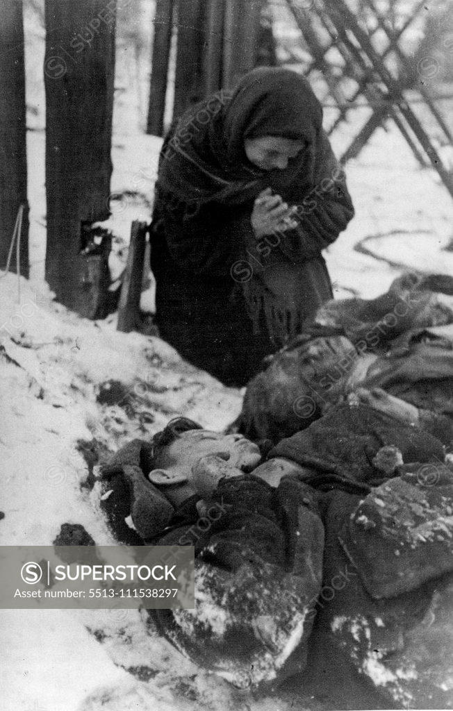 Stock Photo: 5513-111538297 Hitlerites' atrocities in the occupied Soviet regions: Matrena Ossina, of Rostov on Don, found the bodies of her son and grandson shot by Germans. January 10, 1943.