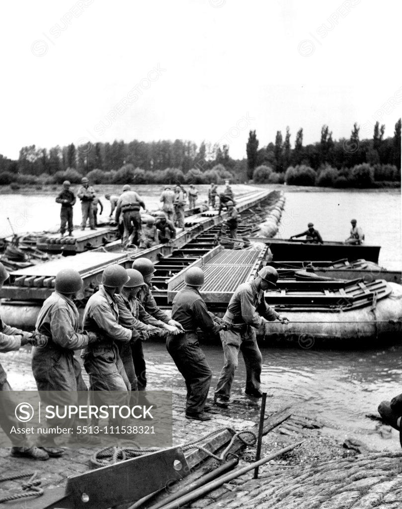 Stock Photo: 5513-111538321 German G.I.'s (Third of Six) - Officers and men of an engineer bridge maintenance company tackle a repair job on a temporary bridge spanning the Rhine river. November 3, 1950. (Photo by ACME).