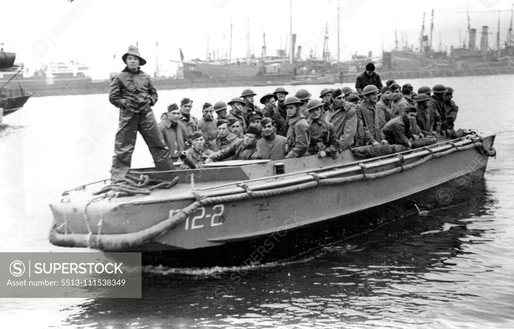 Stock Photo: 5513-111538349 The American Forces Arrive in Iceland: Infantry troops come ashore in a tender from their transports on their arrival in Iceland to Garrison the Island with our own troops. May 24, 1942. (Photo by The Associated Press of Great Britain Ltd.).