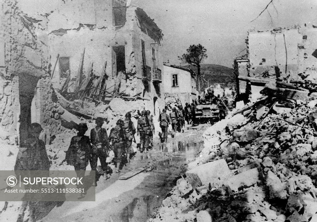 Stock Photo: 5513-111538381 American Infantrymen file through the streets of Battipaglia, Italy after driving out the Germans. October 6, 1943. (Photo by Topical Press).