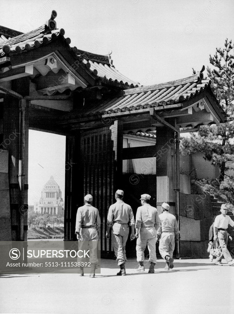 Stock Photo: 5513-111538392 GI's Pass Through Gate of Imperial Palace: A group of strolling GI's are about to pass through one of the gates of the Japanese Imperial Palace in Tokyo. Through the Archway may be seen the dome of the Japanese diet building. September 16, 1945. (Photo by C. P. Gorry, Associated Press Photo).
