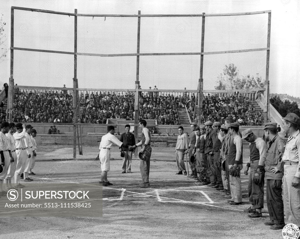Stock Photo: 5513-111538425 Baseball in Korea: At Souel, Korea, the old American game of baseball, banned by the Japanese for 6 years, was revived when a team of American occupation signalmen met a team from the Korean Amateur Association. The Koreans won, 4-3, before a crowd of ten thousand soldiers and civilians. October 25, 1945. (Photo by Davis, US Army Signal Corps Photo).