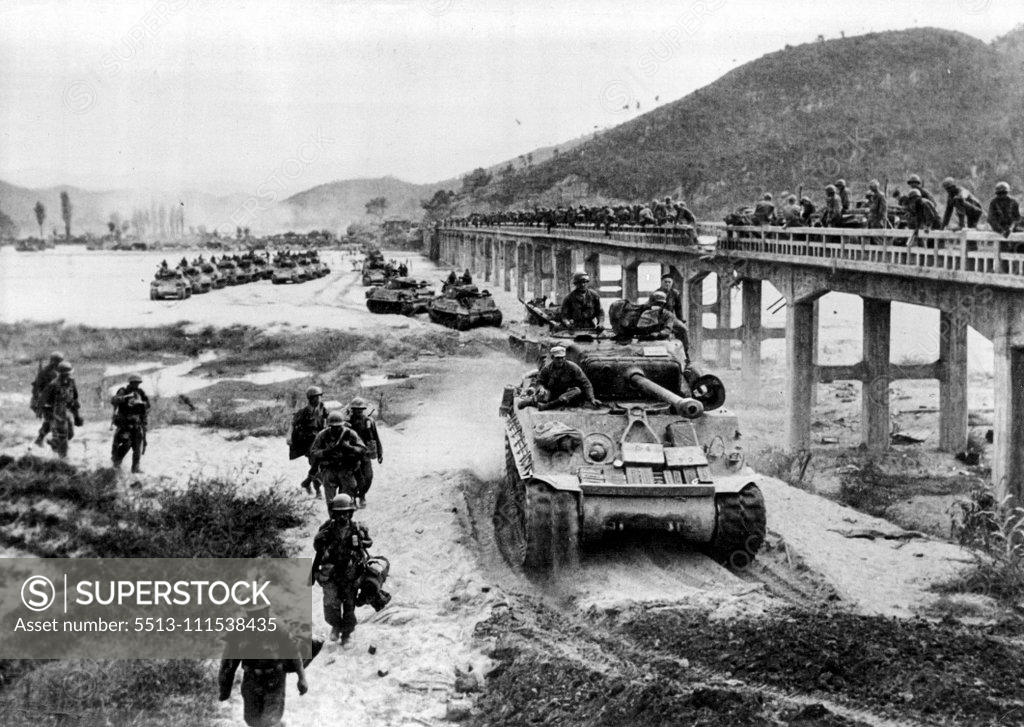 Stock Photo: 5513-111538435 The war in Korea Across the front, the retreating enemy goal, and apparently prepared its resistance in the immediately adjacent perimeter of the capital. Americans and South Koreans are 50 km from Pyongyang. A column of tanks of ***** Infantry Division bypasses a damaged bridge on the Hwang-Gang river. October 17, 1950.
