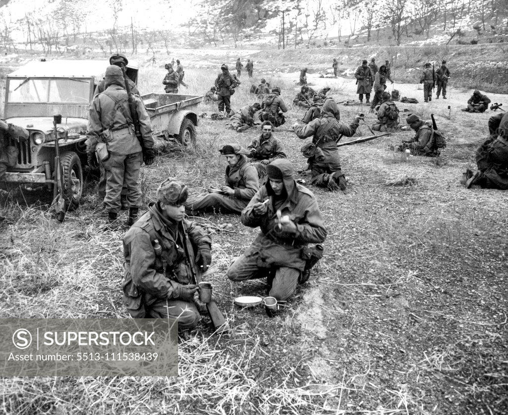 Stock Photo: 5513-111538439 A Day With the 25th (first of ten) - "Breakfast Nook" for GI's of the 25th division on a cold February morning is an open field. Food was brought up in trailer attached to jeep (left). February 3, 1951. (Photo by ACME).
