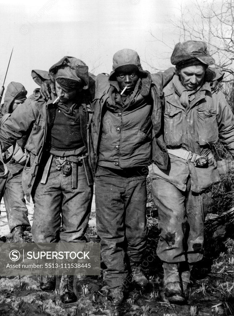Stock Photo: 5513-111538445 Wounded and weak through lack of food, American soldiers stagger into an Australian position in Korea. The men had been held prisoners by the Communists. March 8, 1951.