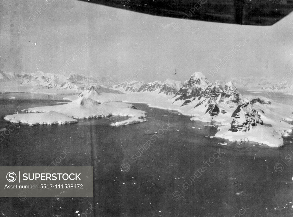 Stock Photo: 5513-111538472 Captain Sir Hubert Wilkins stirring camera record of the second Hearst-Wilkins Antarctic Expedition. These exclusive pictures taken by Captain Sir Hubert Wilkins from an inspiring photographic record of the second Hearst-Wilkins Antarctic Expedition, revealing more of the icy secrets of that vast, mysterious and almost inaccessible polar continent. The base for the expedition was established at deception Island, an old whaling observations and taking pictures. The other members of the expedition