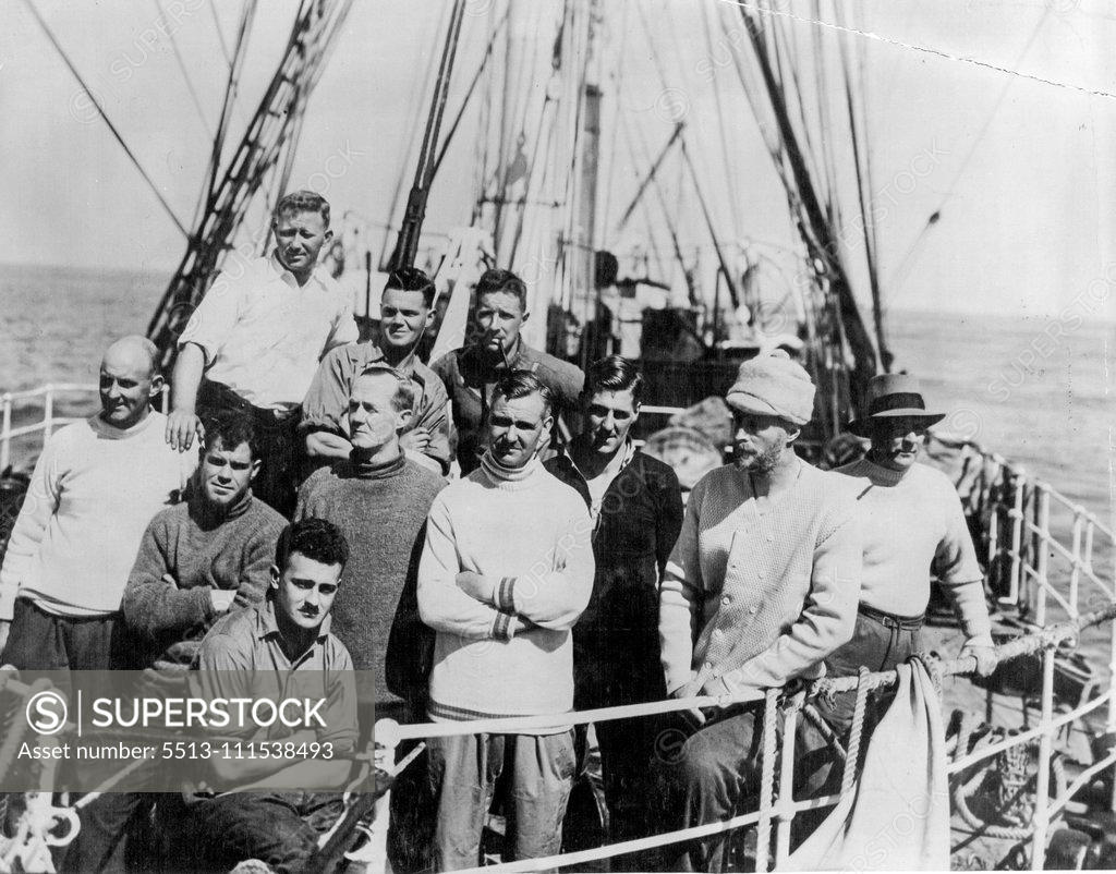 Stock Photo: 5513-111538493 Home from Antarctic Seas: Members of the scientific staff of B.A.N.Z. Antarctic Research Expedition who arrived in Adelaide on 1 April after an extensive cruise in Antarctic and Sub-Antarctic Seas. Sitting in front ... A. Howard. First row L to R ... R. G. Simmers, Sir Douglas Mawson, Com. Morton H. Moyes. Back Row L to R .,.. H. O. Fketcher, R. A. Falla, S.A.C. Campbell. April 15, 1930. (Photo by Captain Frank Hurley, The Herald Feature Service).