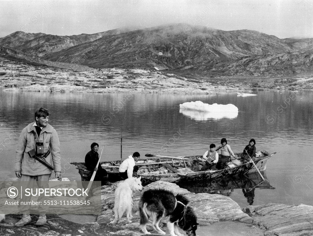 Stock Photo: 5513-111538545 British Arctic Expedition: Journeys End. Croft on left, showing native skin boat rowed by women. November 26, 1934.