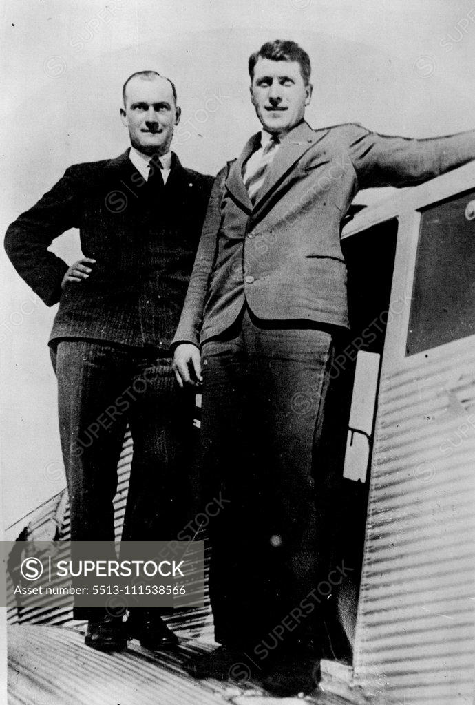 Stock Photo: 5513-111538566 Andree Expedition Discovery: (Left) Pilot Poll and his mechanic Malm, who are bringing photographs from Tromso to England of the Andree Expedition discovery. October 15, 1930. (Photo by The Times).