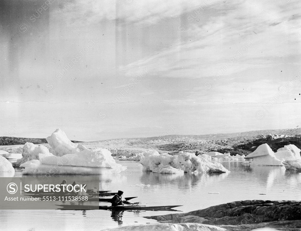 Stock Photo: 5513-111538588 British Arctic Air Route Expedition: Four Greenlanders about to return home to Angmagssalik, the day after assisting the motor-boat to reach the base. September 22, 1931, (Photo by British Arctic Air Route Expedition Photograph).