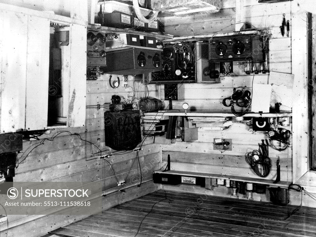 Stock Photo: 5513-111538618 British Arctic Air Route Expedition: The expedition's wireless station GKN which occupies a corner of the main room of the hut at the Base Camp. July 30, 1931. (Photo by Cozens, British Arctic Air Route Expedition Photograph).